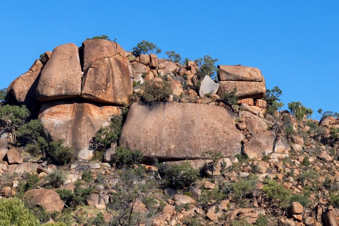 Majestic rock formations in Western Australia under blue sky, symbolizing robustness akin to Platinum Calibrations services in Perth.