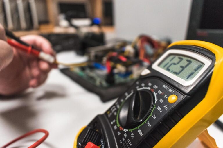 Technician calibrating electronic equipment for accurate readings in Perth, Western Australia